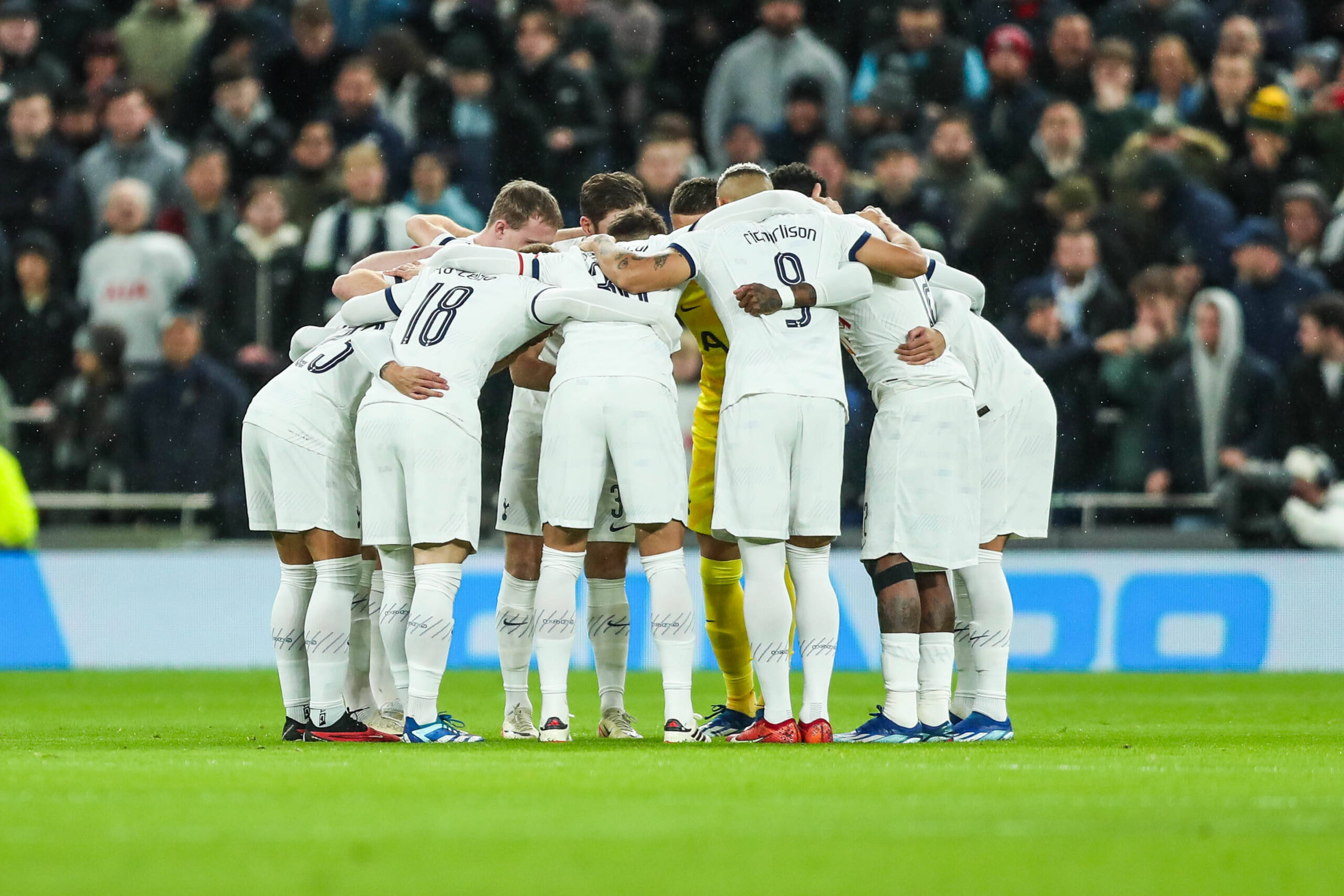 Tottenham Hotspur players huddle before a match