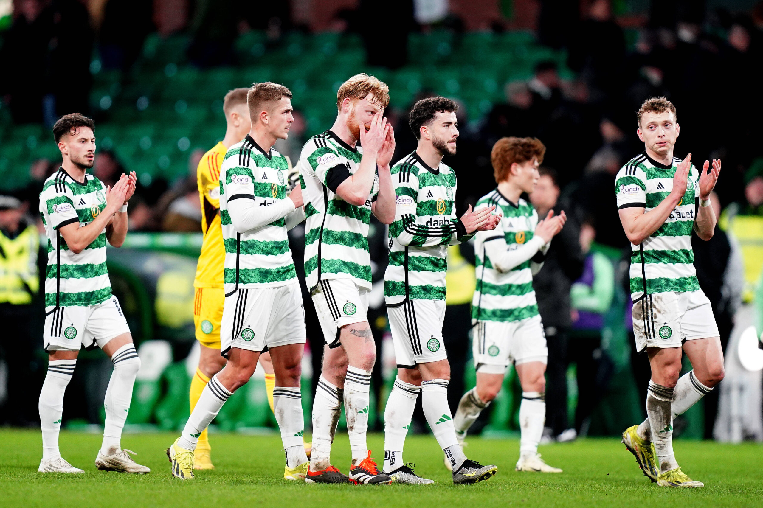 Celtic players applaud the fans as they leave the pitch