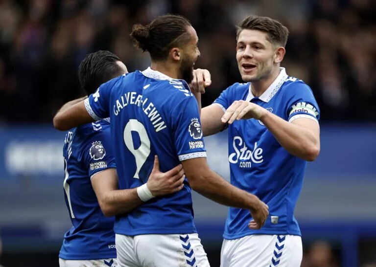 Everton players celebrating after scoring a goal against Tottenham Hotspur.