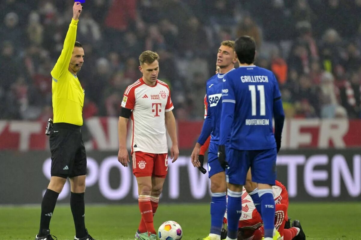 Edited image showing a refereee giving a player a blue card instead of a yellow card