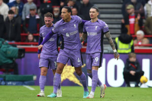 Virgil van Dijk, Alexis Mac Allister and Darwin Nunez celebrate a goal against Brentford.