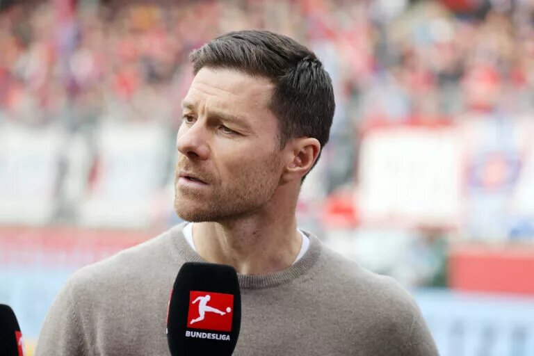 Xabi Alonso speaking to Bundesliga media