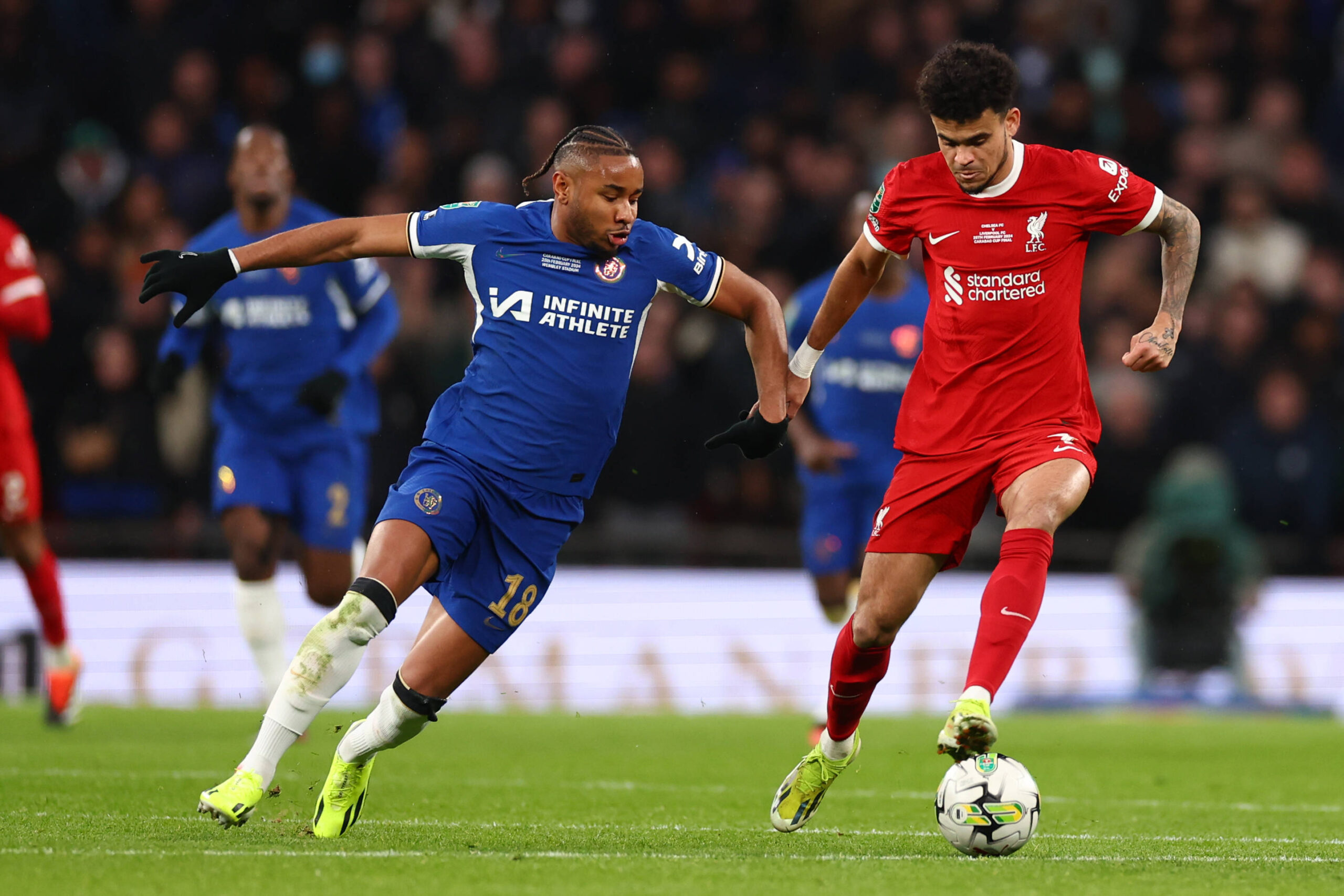 Chelsea's Christopher Nkunku fights for the ball with Liverpool's Luis Diaz