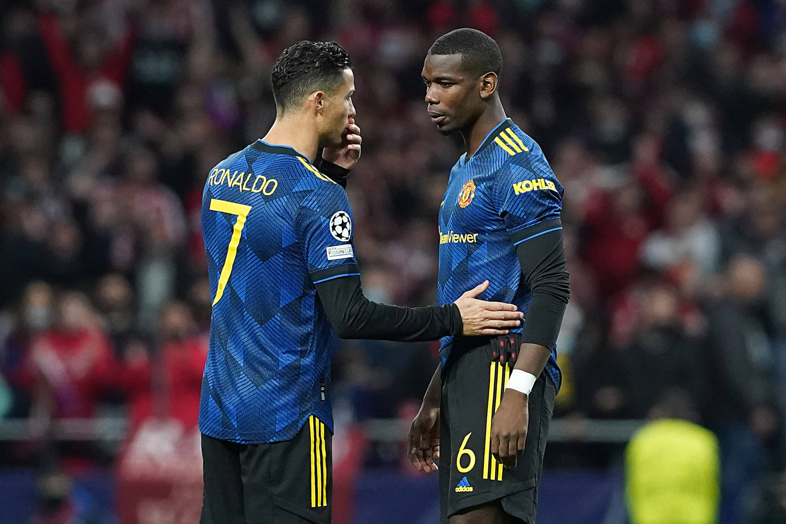 Cristiano Ronaldo and Paul Pogba speaking during a match