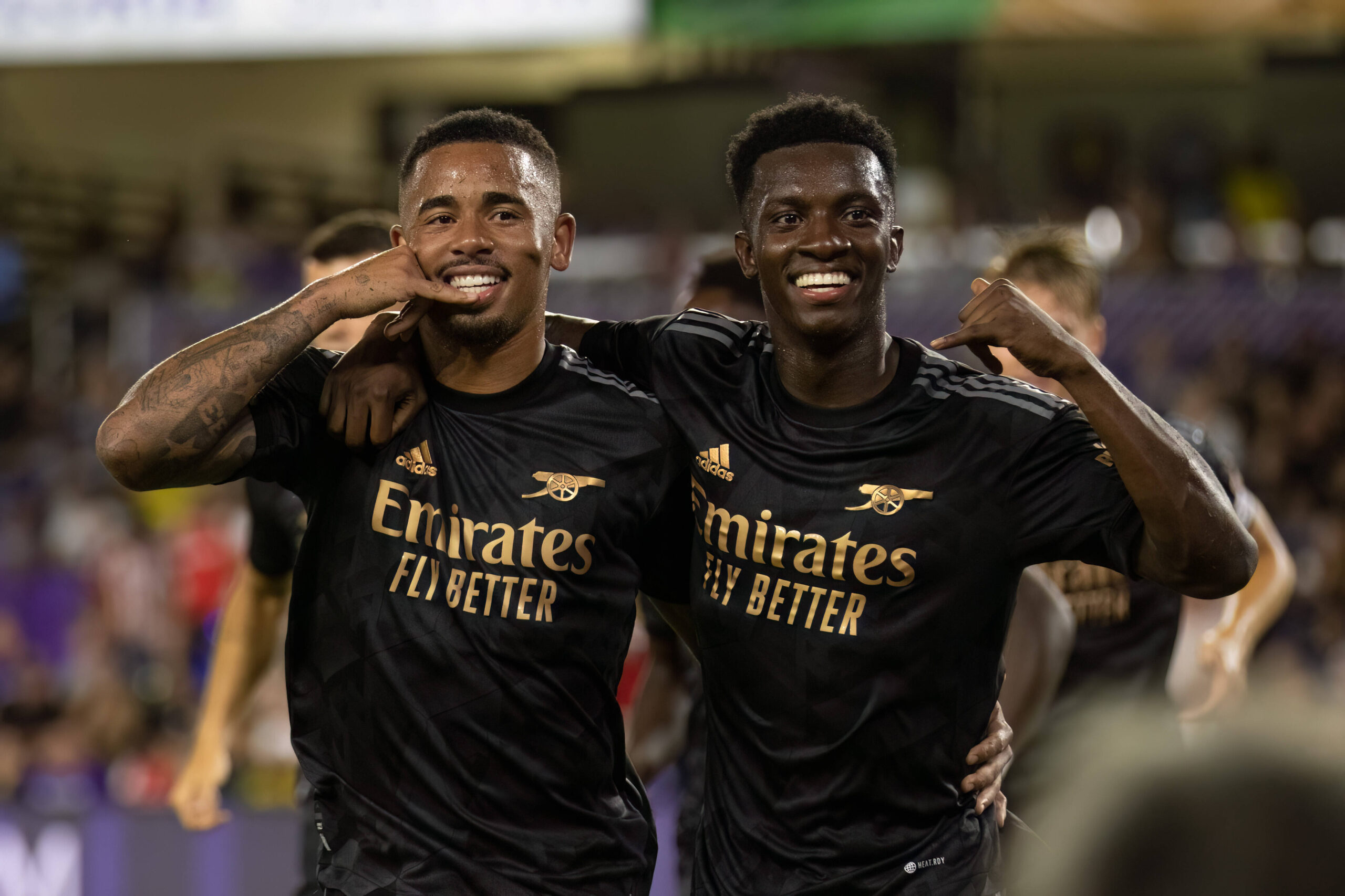 Gabriel Jesus and Eddie Nketiah celebrate a goal against Orlando City FC.