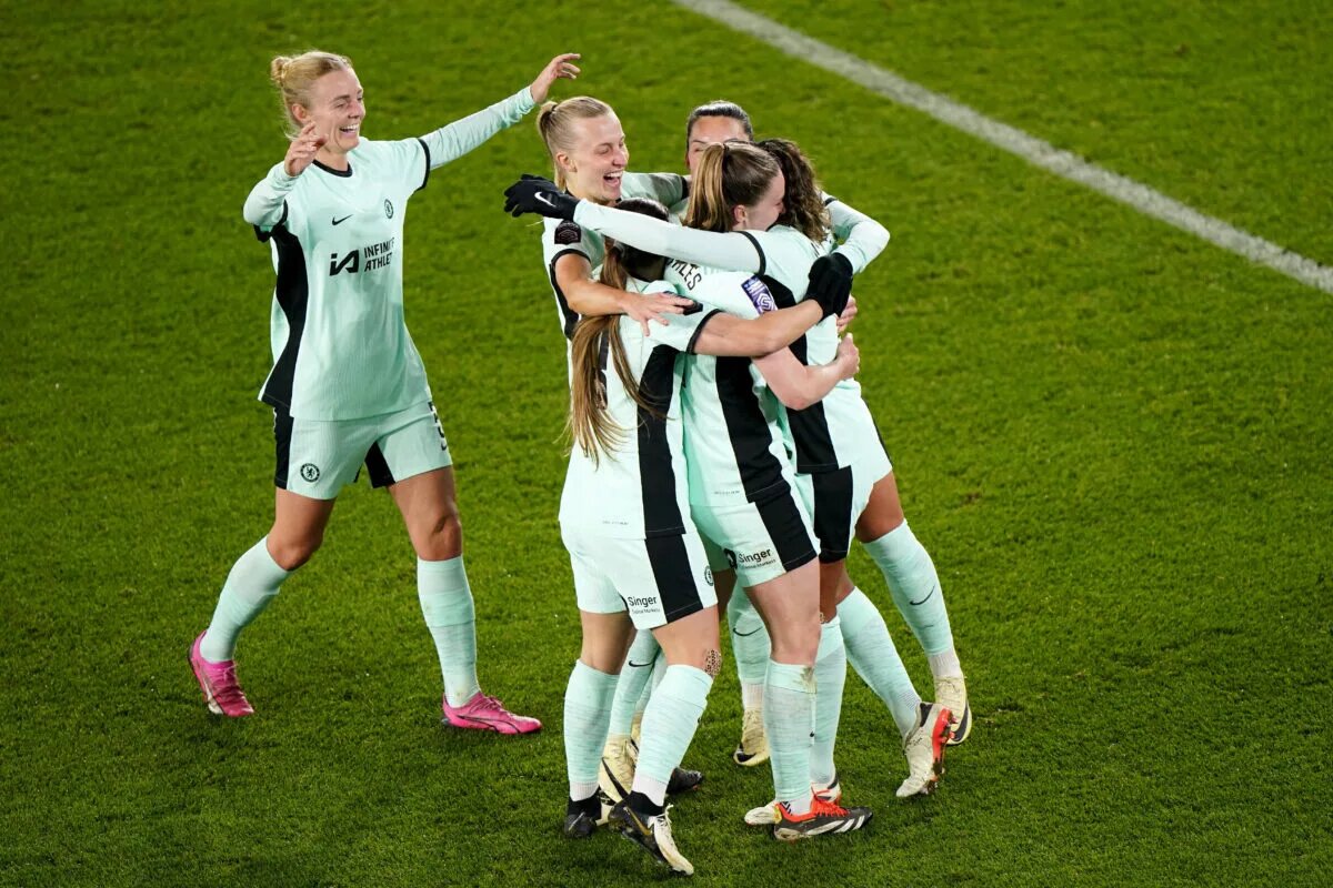 Cat Macario celebrates comeback goal with teammates embrace