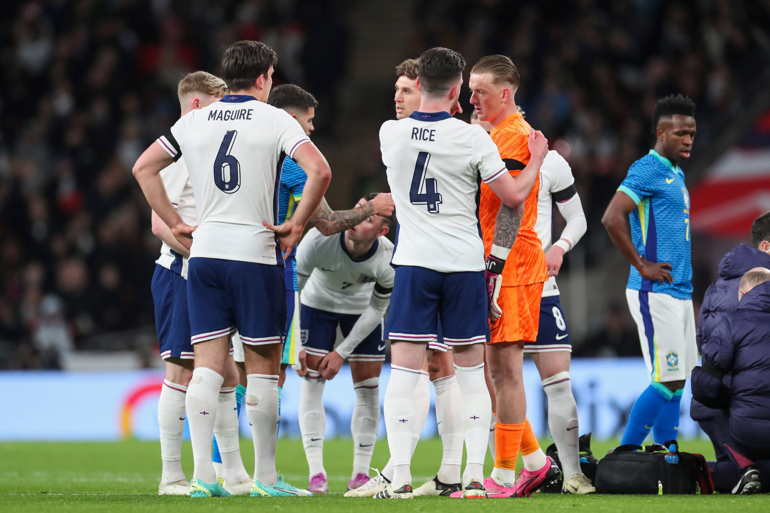 Declan Rice England captain stood with Harry Maguire, Jordan Pickford and England team-mates vs Brazil