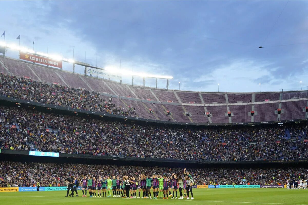 Barcelona Femeni squad line up at Camp Nou after their win over Chelsea Women