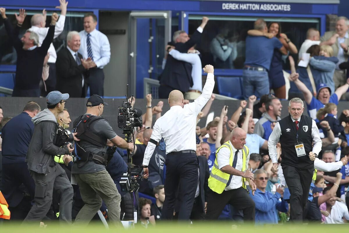 Sean Dyche celebrates as the full time whistle blows confirming his side are safe from relegation