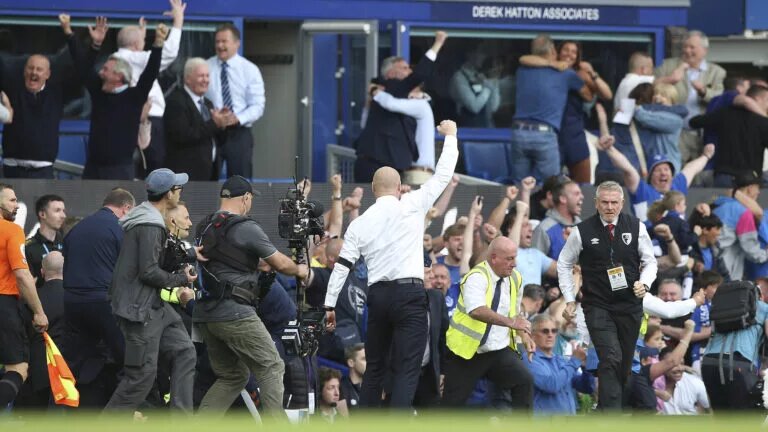 Sean Dyche celebrates as the full time whistle blows confirming his side are safe from relegation