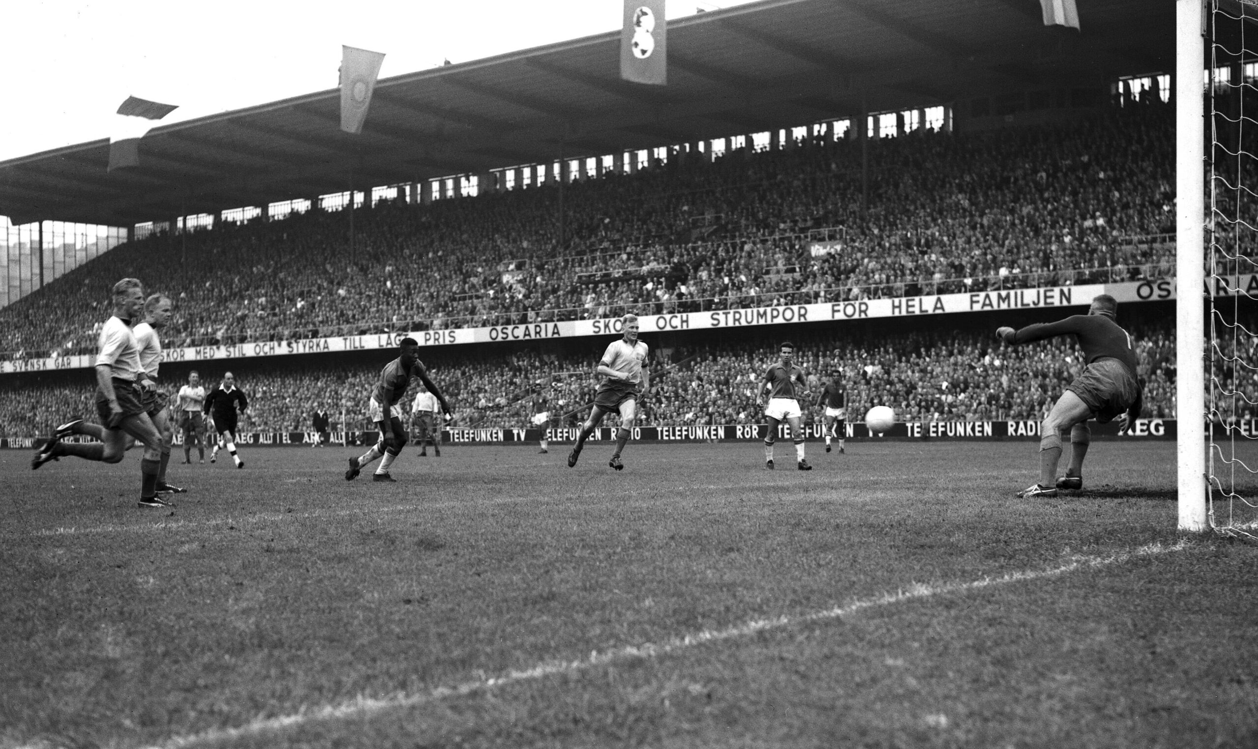 Image of Pele breakign free in the box to score during the World Cup final