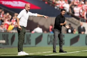 Pep Guardiola and Mikel Arteta coaching on the sidelines
