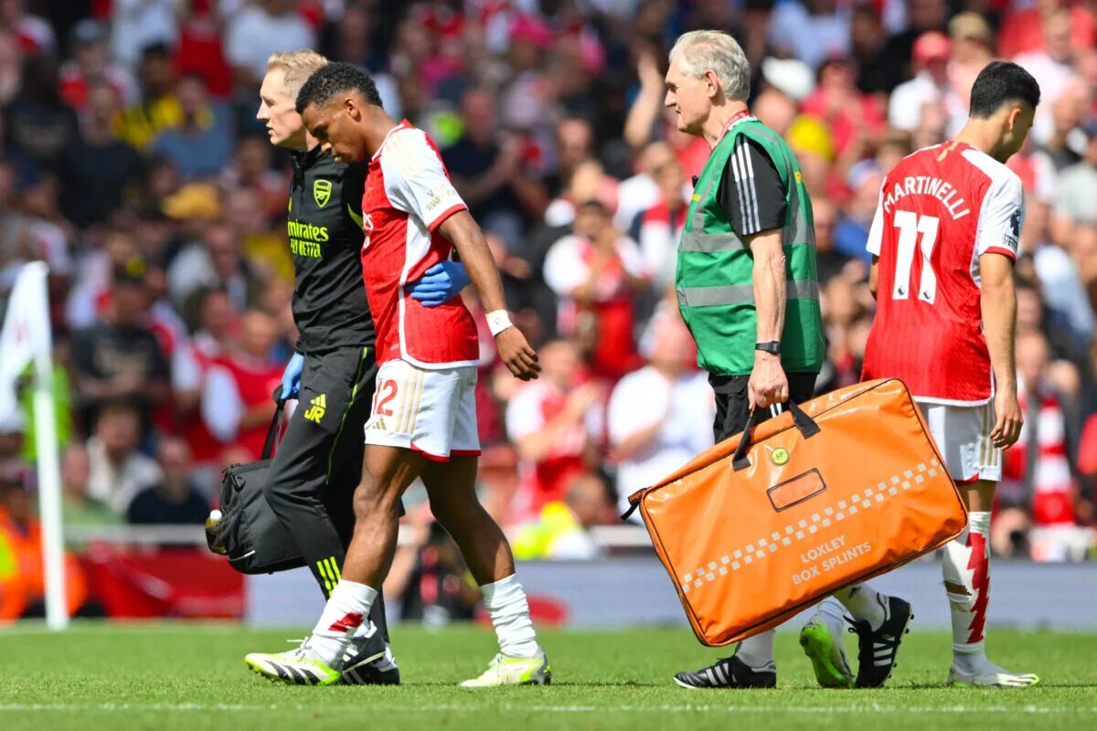 Jurrien Timber leaving the field with the medical team