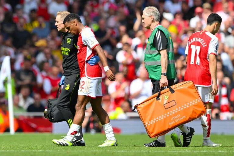 Jurrien Timber leaving the field with the medical team