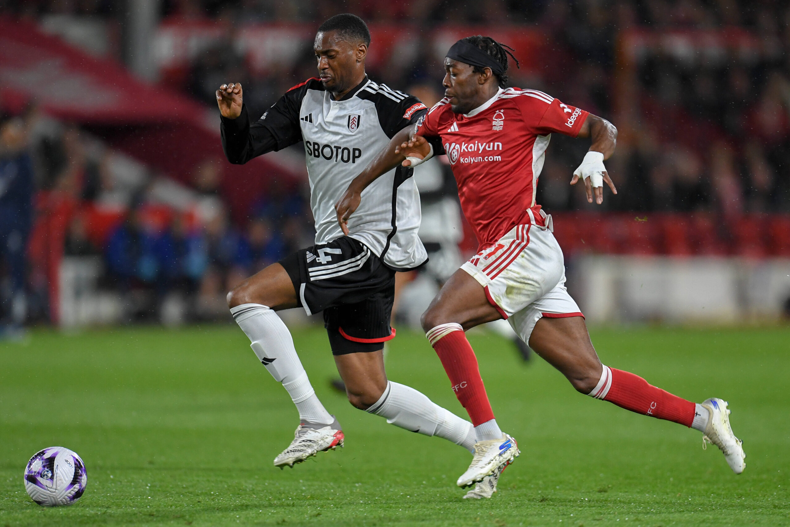 Fulham defender Tosin Adarabioyo battles for the ball with Nottigham Forest's Anthony Elanga