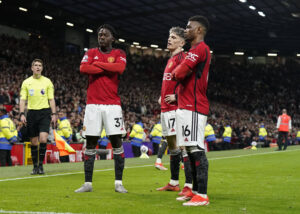 Manchester United players celebrate Kobbie Mainoo goal
