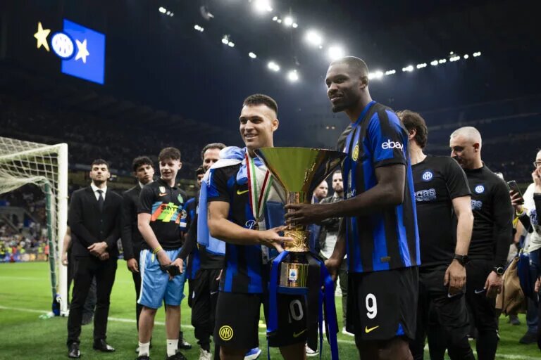 Inter players celebrate with the Serie A trophy