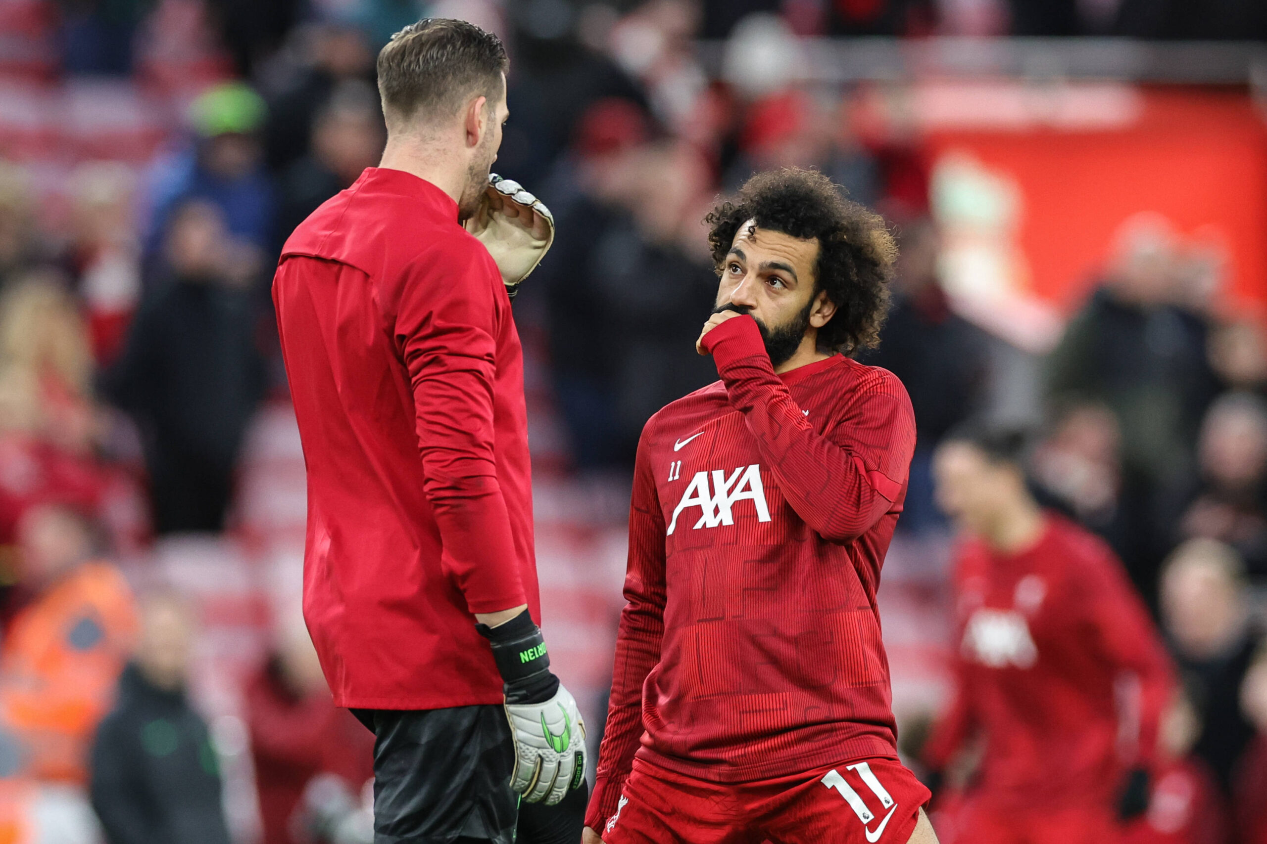 Adrian and Mo Salah speaking during pre-match warmup