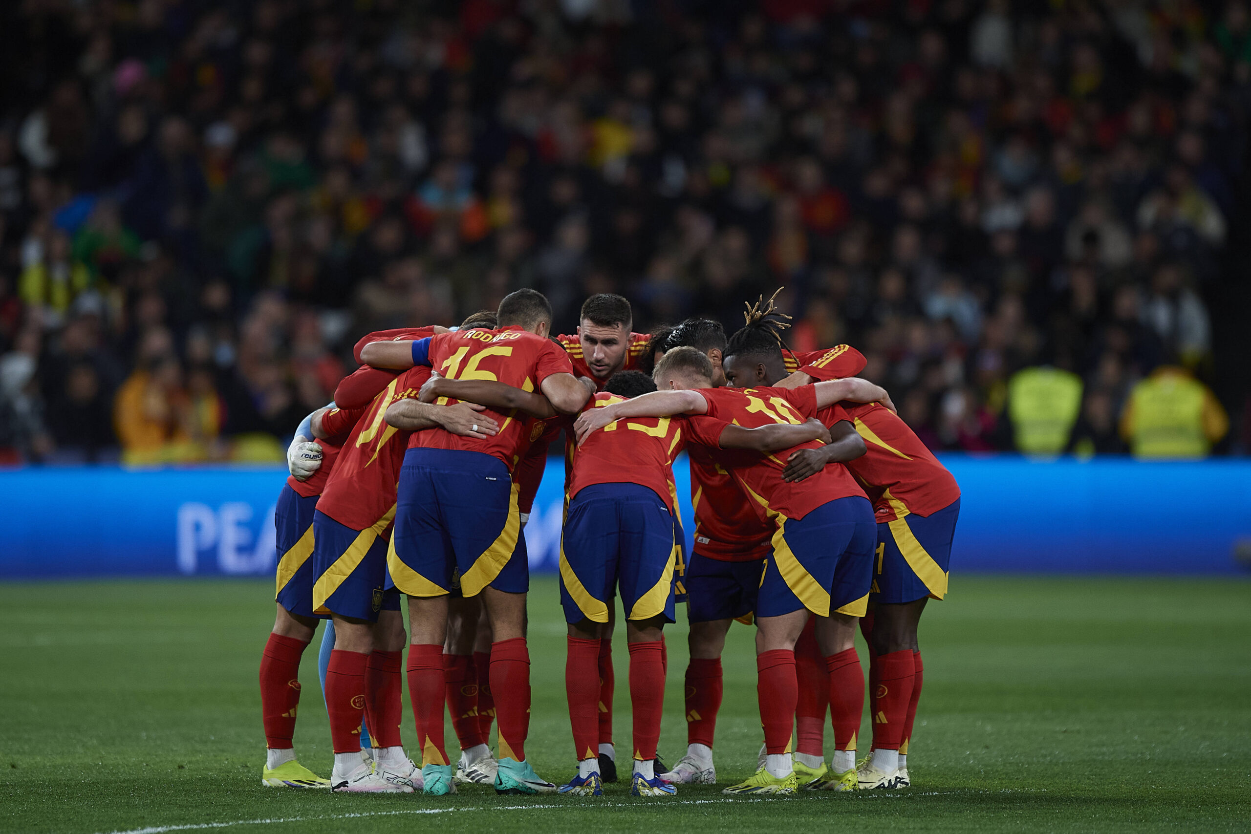 Spain squad huddles before a match