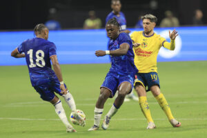 Romeo Lavia and Christopher Nkunku in action against Club America