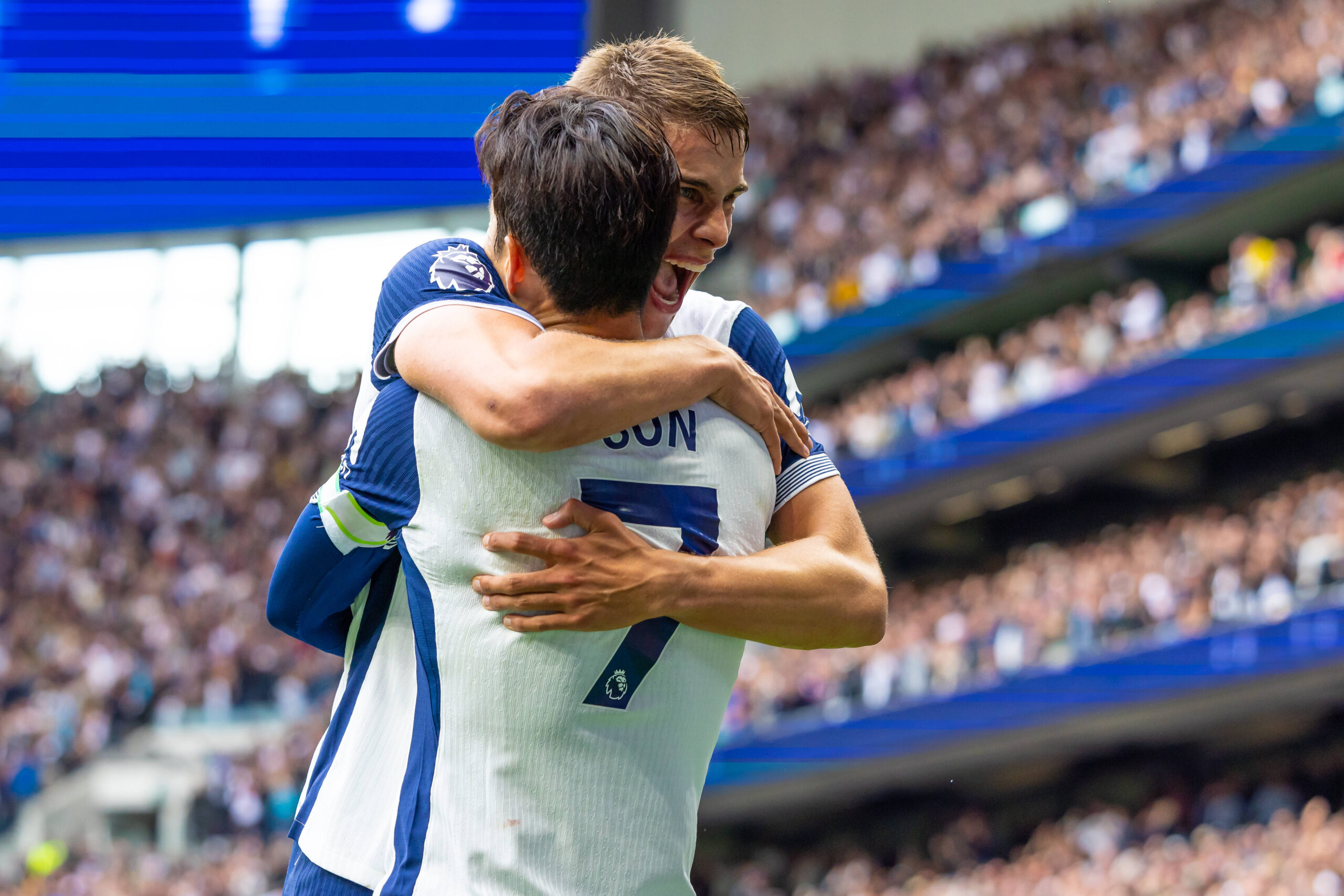 Micky van de Ven and Son Heung Min embrace in celebration