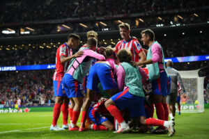 Atletico Madrid players celebrate in huddle