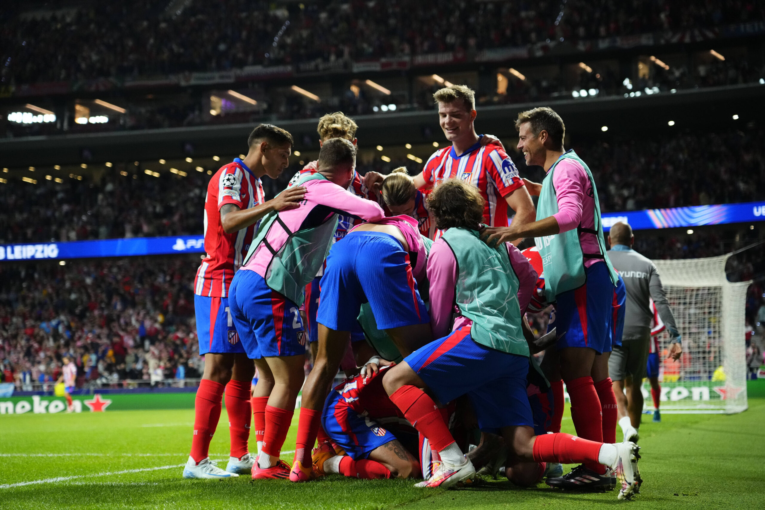 Atletico Madrid players celebrate in huddle