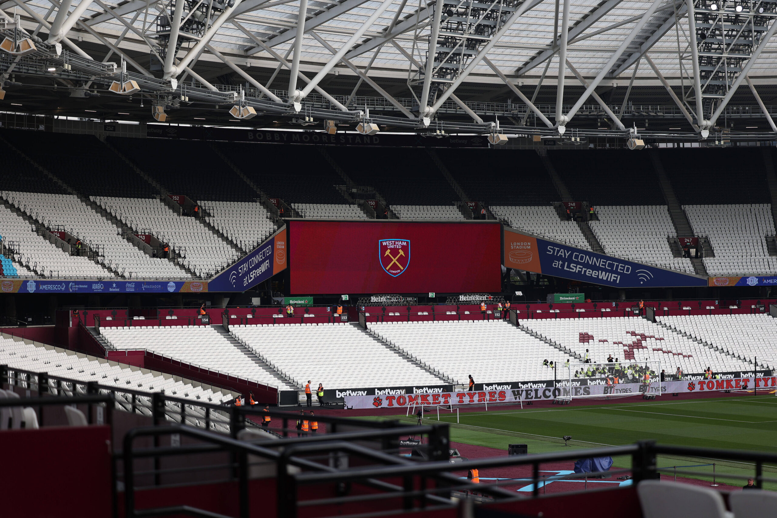 Image of an empty London Stadium showing West Ham's logo