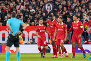 Liverpool team-mates including Ibrahima Konate celebrate after Alexis Mac Allister scores