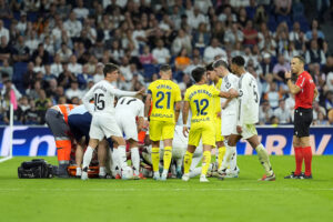 Real Madrid players surround injured Dani Carvajal as he receives treatment