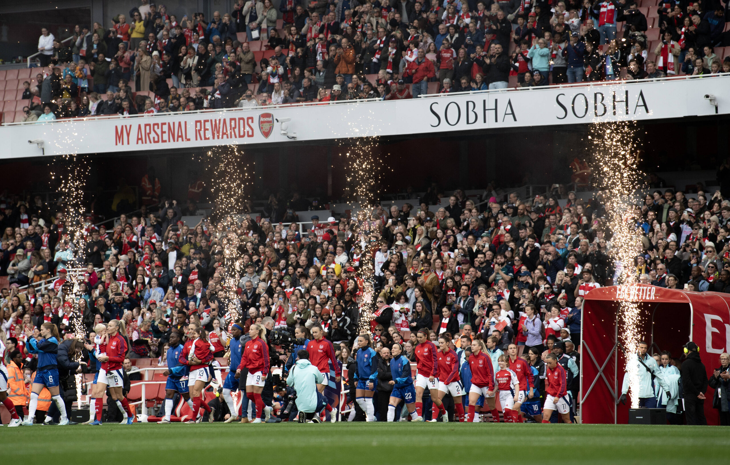 Chelsea Women and Arsenal Women enter the pitch at the Emirates