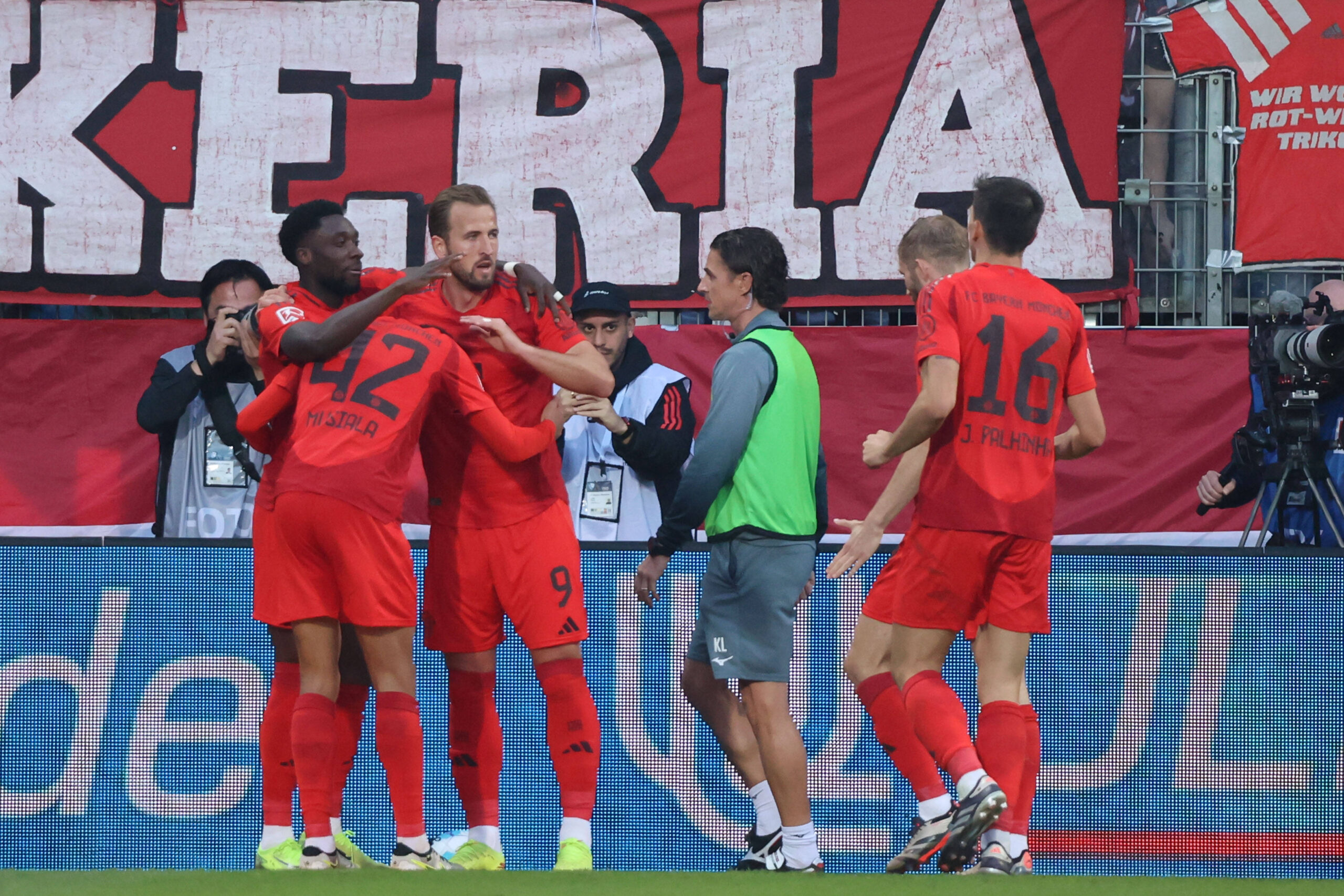 Harry Kane celebrates with Bayern Munich team mates