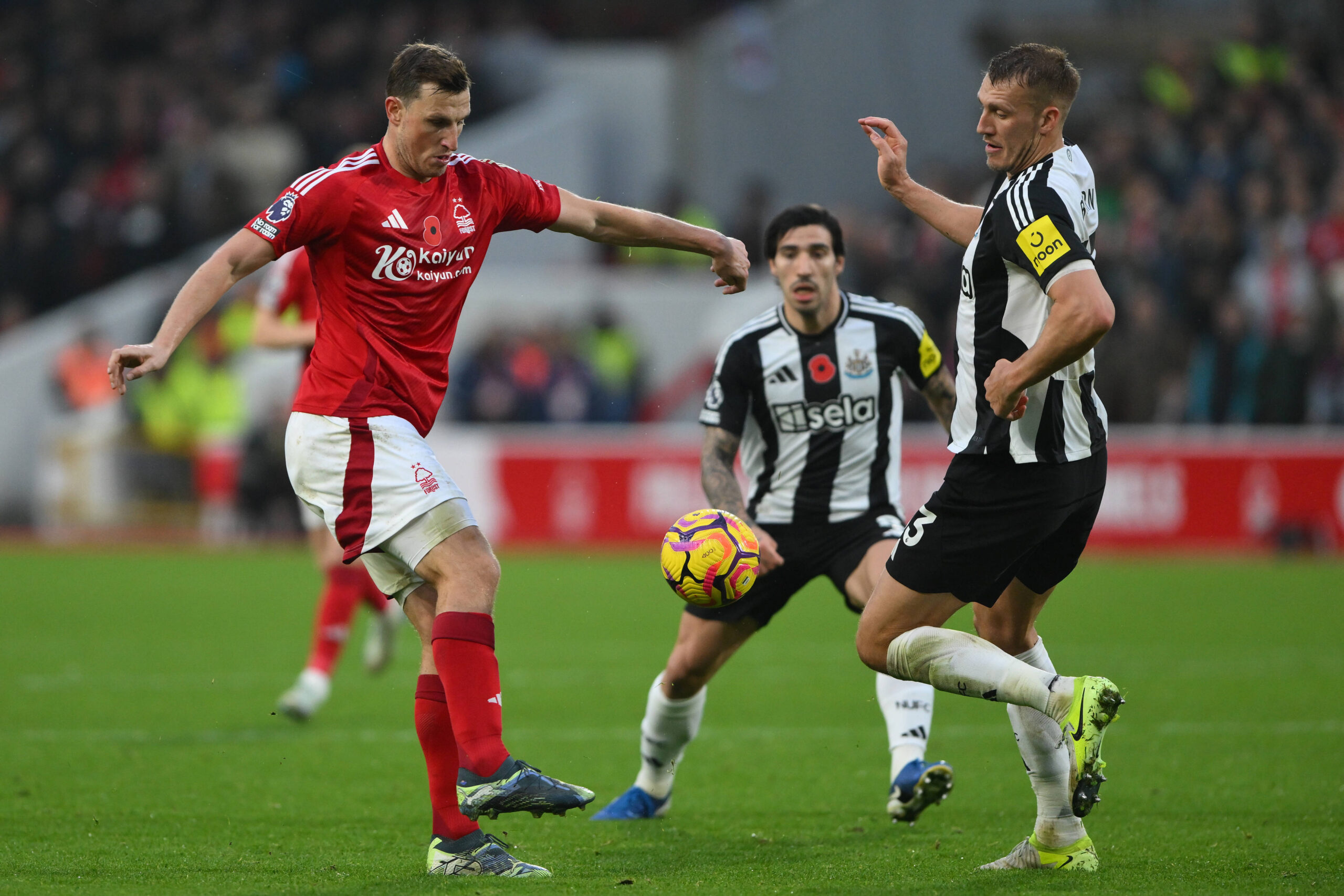 Chris Wood strikes ball past Dan Burn