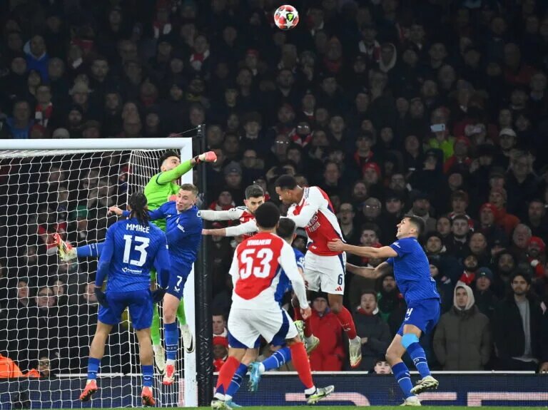 Dinamo Zagreb goalkeeper Dominik Livaković challenges Arsenal attackers
