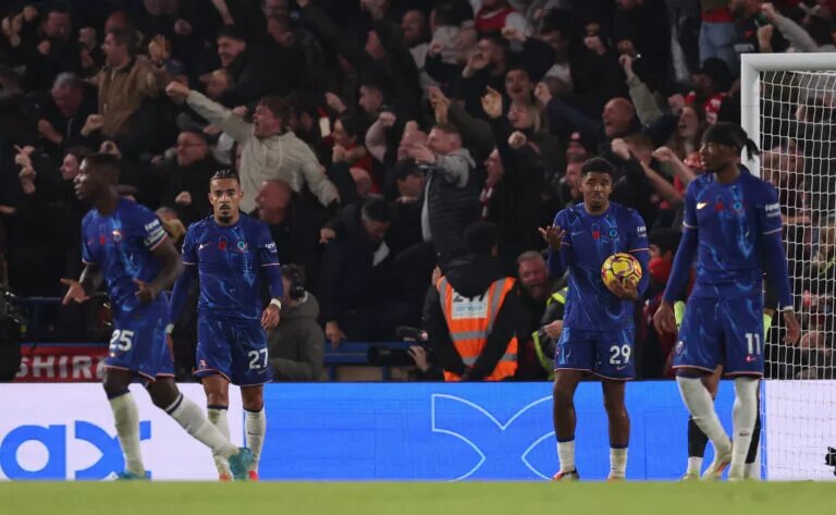 Wesley Fofana holds the match ball after Chelsea conceded against Arsenal