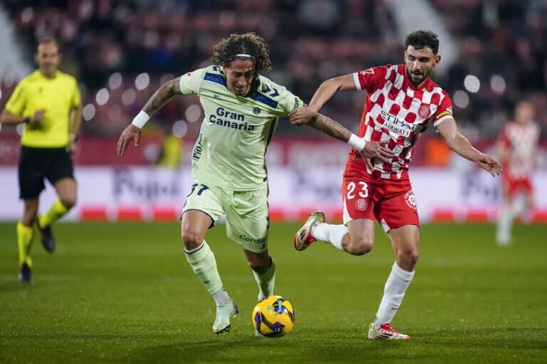 Fabio Silva competes for the ball