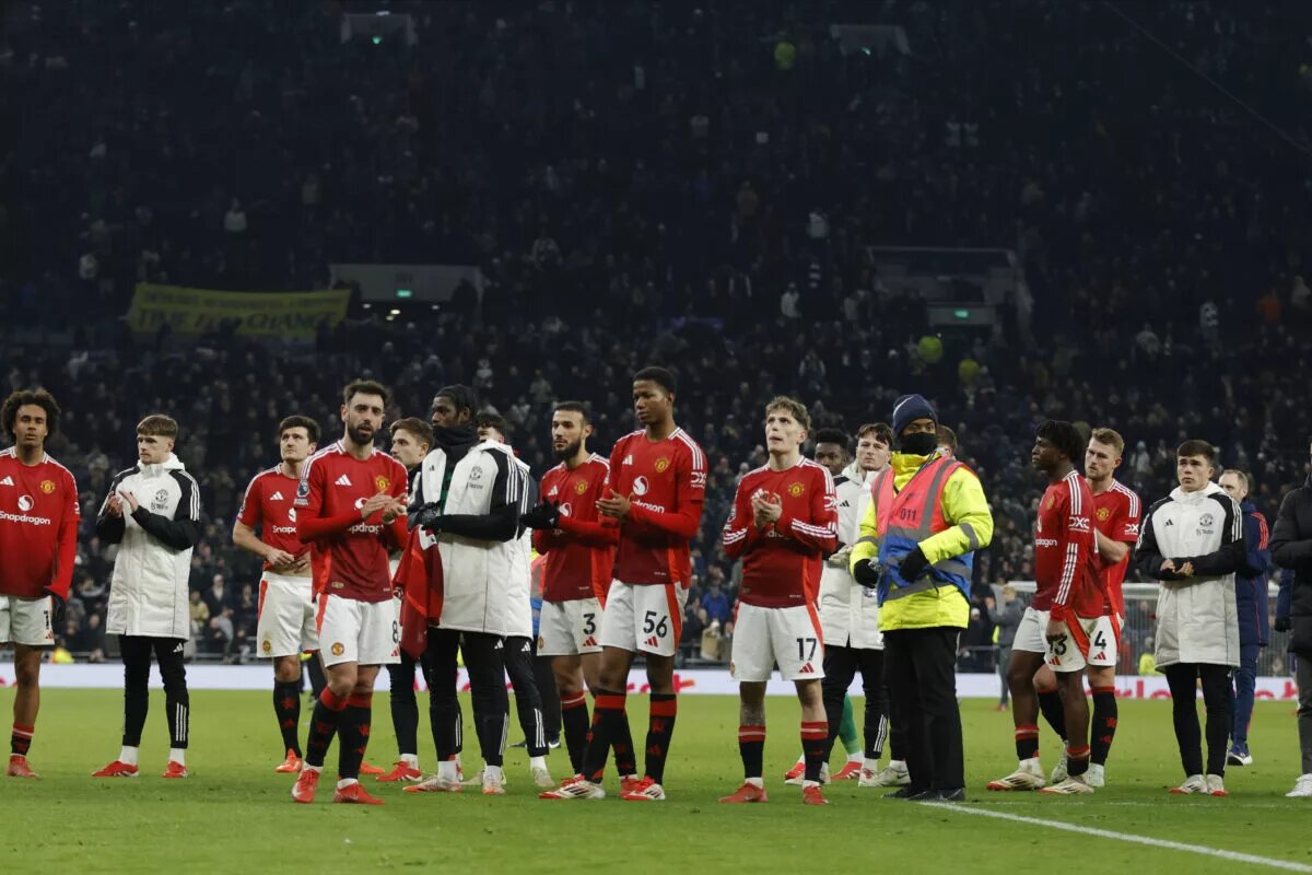 Manchester United fans pictured applauding fans following a match