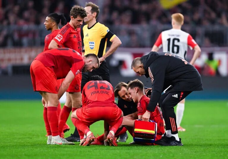 Eric Dier and Thomas Muller console the injured Joshua Kimmich