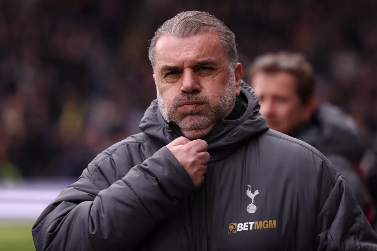 Ange Postecoglou adjusts his Tottenham Hotspur coat and puffs his cheeks in frustration