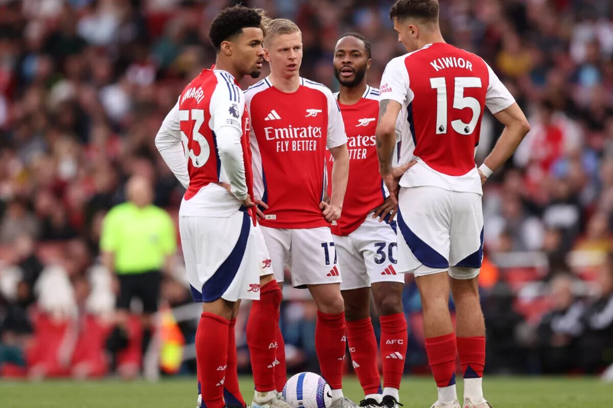 Jakub Kiwior, Ethan Nwaneri, Raheem Sterling and Oleksandr Zinchenko stand together