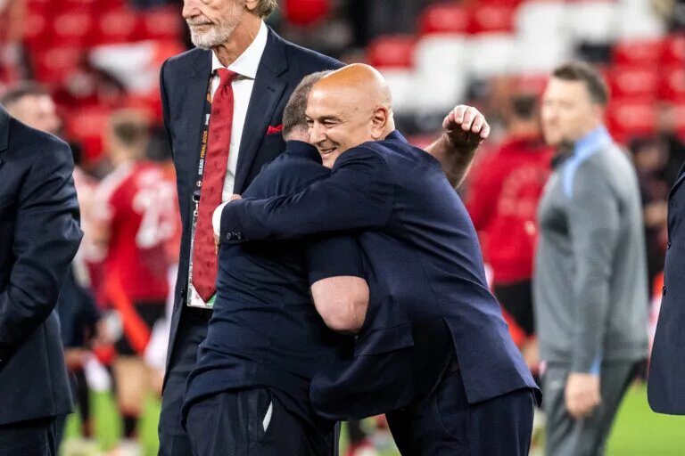 Ange Postecoglou embraces Tottenham Hotspur chairman Daniel Levy after Europa League win