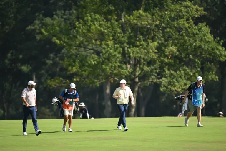 Scottie Scheffler and caddie at 2025 BMW Championship