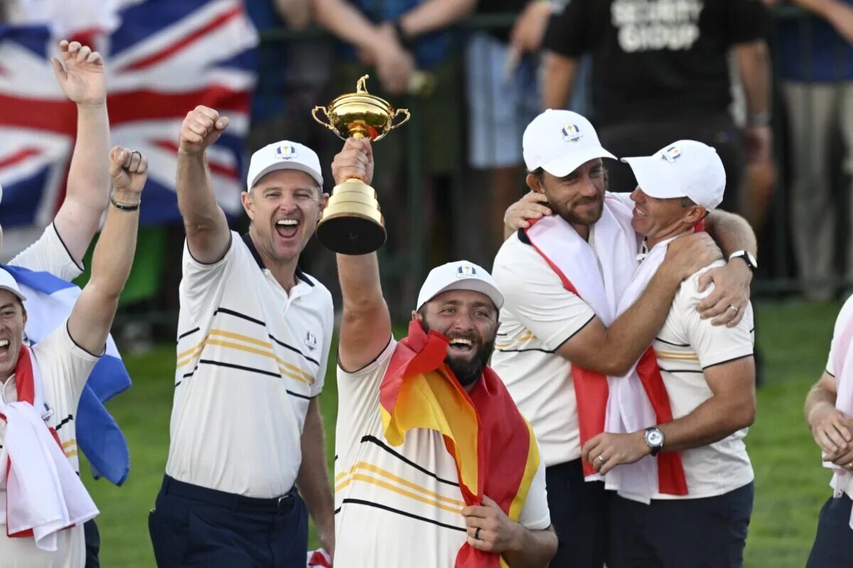 Jon Rahm holding 2025 Ryder Cup trophy