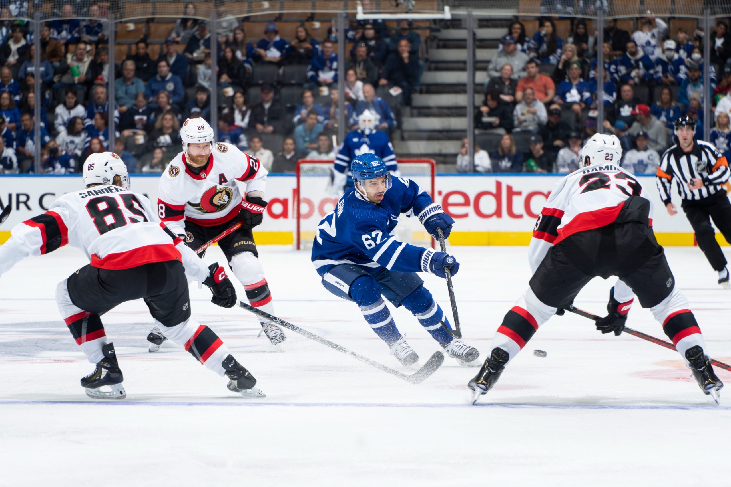 Toronto Maple Leafs forward Denis Malgin (62) makes a neutral zone pass in the Toronto Maple Leafs preseason opener on September 25, 2022.