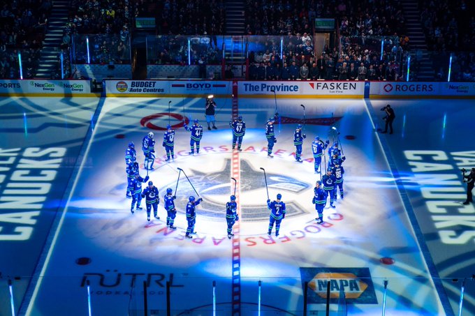 Fans boo Canucks and throw jerseys on the ice in home opener loss