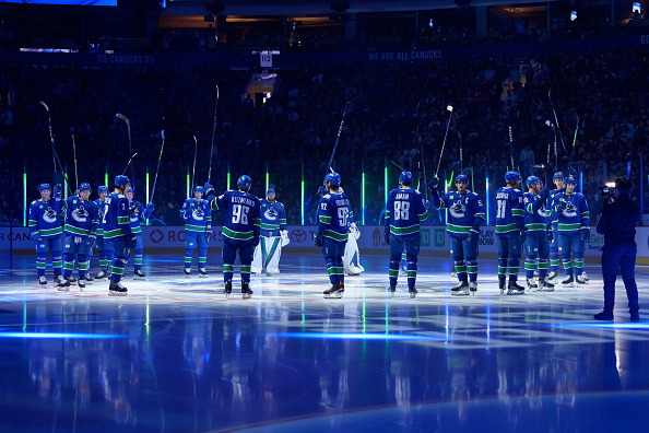 The Vancouver Canucks salute the fans prior to their NHL game against the Buffalo Sabres at Rogers Arena October 22, 2022 in Vancouver, British Columbia, Canada. Buffalo won 5-1.