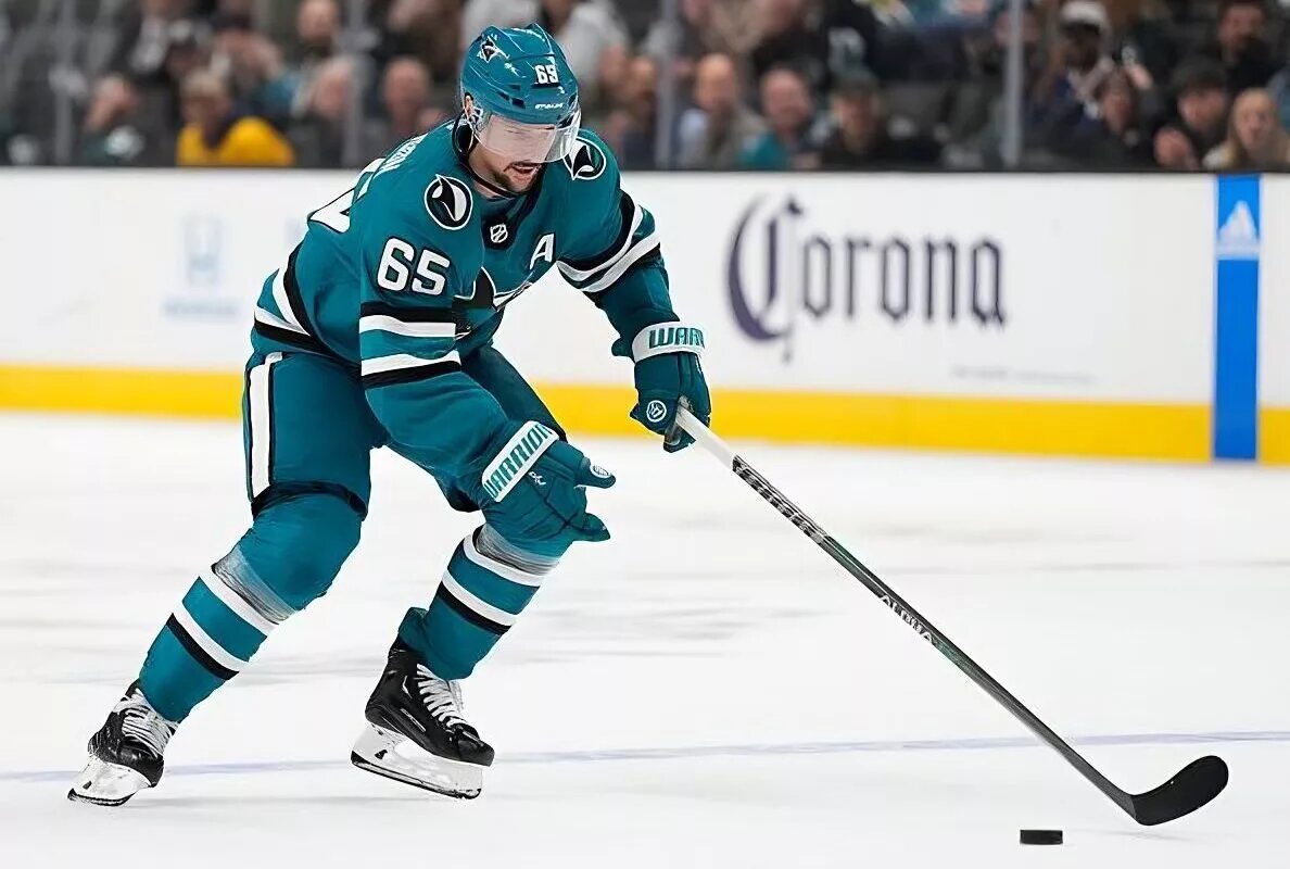 SAN JOSE, CALIFORNIA - OCTOBER 27: Erik Karlsson #65 of the San Jose Sharks skates up ice on a break away against the Toronto Maple Leafs during the overtime period of an NHL hockey game at SAP Center on October 27, 2022 in San Jose, California. (Photo by Thearon W. Henderson/NHL Getty Images)
