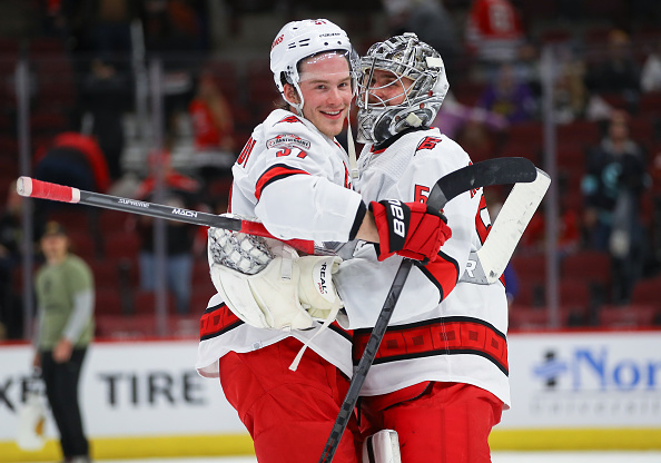 Carolina Hurricanes right wing Andrei Svechnikov (37) and Carolina Hurricanes goaltender Pyotr Kochetkov (52) greet each other after a game between the Carolina Hurricanes and the Chicago Blackhawks on November 14, 2022 at the United Center in Chicago, IL.