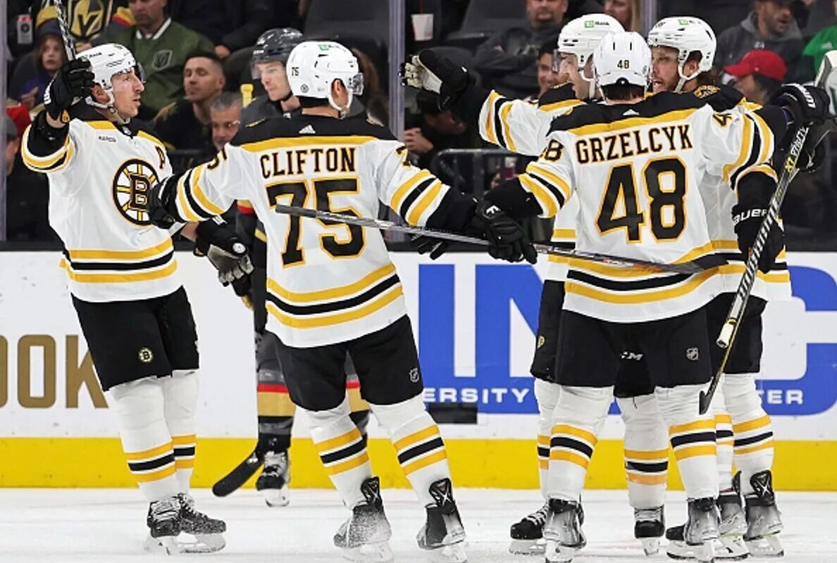 LAS VEGAS, NEVADA - DECEMBER 11: NHL Atlantic Division Boston Bruins celebrate a second-period goal against the Vegas Golden Knights by Patrice Bergeron #37 during their game at T-Mobile Arena on December 11, 2022 in Las Vegas, Nevada. The Bruins defeated the Golden Knights 3-1. (Photo by Ethan Miller/Getty Images)