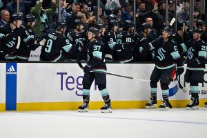 NHL Pacific Division: Seattle Kraken players celebrate goal scored by forward Yanni Gourde
